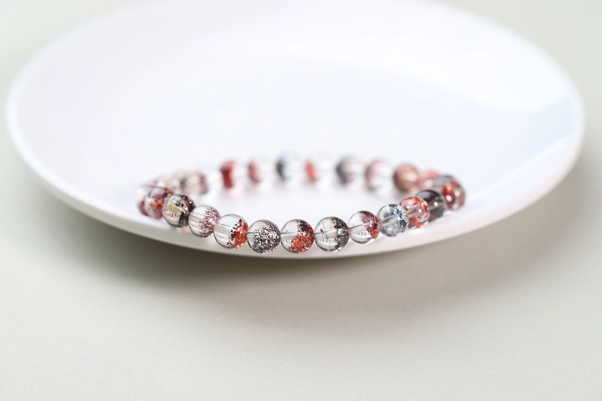 Red Inclusion Quartz Bracelet | Clear Crystal with Fiery Sparks for Vitality, Passion & Grounded Action | Root Chakra Gift BuddhaCrystal